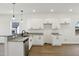 Bright kitchen featuring white cabinets, granite countertops, and stainless steel appliances at 2301 Pinecroft Dr, Burlington, NC 27217