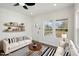 Cozy living room with sofas, stylish rug, and well-placed shelving at 2301 Pinecroft Dr, Burlington, NC 27217