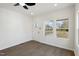 A living room featuring new floors, fresh paint, new light fixtures, windows, and a backdoor at 2301 Pinecroft Dr, Burlington, NC 27217