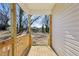 Covered back porch with wooden railings and view of the backyard at 2301 Pinecroft Dr, Burlington, NC 27217