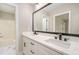 Bathroom featuring double vanity with white marble countertop and black fixtures at 2324 Dahlgreen Rd, Raleigh, NC 27615