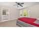 Bedroom with bay window and ceiling fan, plus ensuite bathroom with tiled floor at 2324 Dahlgreen Rd, Raleigh, NC 27615