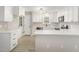 Well-equipped kitchen with white cabinets, modern appliances, and sleek countertops for cooking at 2324 Dahlgreen Rd, Raleigh, NC 27615