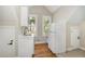 Kitchenette with new cabinets, sink and refrigerator at 2324 Dahlgreen Rd, Raleigh, NC 27615