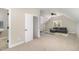 Open living room features a cozy sofa, neutral carpet and walls at 2324 Dahlgreen Rd, Raleigh, NC 27615
