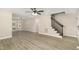 Spacious living area with new flooring and staircase, perfect for entertaining and relaxing at 2324 Dahlgreen Rd, Raleigh, NC 27615