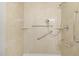 Accessible shower featuring grab bars and adjustable shower head at 2324 Dahlgreen Rd, Raleigh, NC 27615