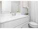 Clean bathroom featuring a white vanity, stylish faucet, light gray walls, and a white toilet at 234 Macon Lake Drive # 39, Apex, NC 27523