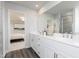 Bright bathroom features a double sink vanity, framed mirror, and natural lighting at 234 Macon Lake Drive # 39, Apex, NC 27523