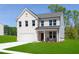 Stunning two-story home boasts a classic brick facade, attached garage, and well-manicured lawn under a clear blue sky at 242 Macon Lake Drive # 37, Apex, NC 27523