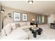 Comfortable living room features a sectional sofa, side table, and lots of natural light at 242 Macon Lake Drive # 37, Apex, NC 27523