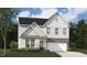 Charming two-story home featuring a brick foundation and a two-car garage at 246 Macon Lake Drive # 36, Apex, NC 27523