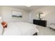 Bright bedroom features modern art, light furniture, carpet, and a large double bed at 254 Macon Lake Drive # 34, Apex, NC 27523