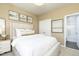 Serene bedroom featuring a plush bed, stylish decor, and ample natural light, creating a relaxing retreat at 254 Macon Lake Drive # 34, Apex, NC 27523