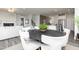 Inviting dining area with a modern table setting, open to the living room and kitchen, enhancing the flow at 254 Macon Lake Drive # 34, Apex, NC 27523