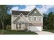 Two-story home boasts a modern design, blending brick and siding for a stylish, eye-catching curb appeal at 254 Macon Lake Drive # 34, Apex, NC 27523