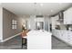 Well-lit kitchen features modern cabinetry, a large center island, stainless steel appliances, and stylish pendant lighting at 254 Macon Lake Drive # 34, Apex, NC 27523