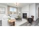 Comfortable living space featuring a fireplace, natural light, and an open layout ideal for relaxing and entertaining at 254 Macon Lake Drive # 34, Apex, NC 27523