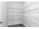 Walk-in pantry with ample shelving, offering efficient storage solutions in a clean, organized space at 254 Macon Lake Drive # 34, Apex, NC 27523