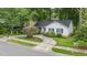 Aerial view of a home showcasing a circular driveway and beautifully landscaped front yard at 2629 Hiking Trl, Raleigh, NC 27615