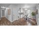 Charming dining area with modern table, white chairs, and hardwood flooring at 2704 Shaftsbury St, Durham, NC 27704