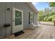 Inviting home entrance featuring a cozy deck with chairs and a welcoming front door at 2704 Shaftsbury St, Durham, NC 27704