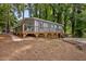 Well-maintained blue house with a wooden deck and a neatly landscaped yard at 2704 Shaftsbury St, Durham, NC 27704