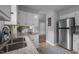 Well-lit kitchen with stainless steel appliances and granite countertops at 2704 Shaftsbury St, Durham, NC 27704