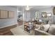 Spacious living room with hardwood floors, modern decor, and seamless flow into the dining area at 2704 Shaftsbury St, Durham, NC 27704