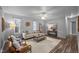 Bright living room with hardwood floors, neutral-toned furniture, and ample natural light at 2704 Shaftsbury St, Durham, NC 27704