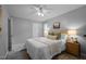 Bedroom featuring neutral colors, updated ceiling fan, and windows providing natural light at 2704 Shaftsbury St, Durham, NC 27704