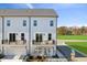 Exterior view of townhomes with private balconies, landscaped front yards, and well-maintained surroundings at 2808 Kempthorne Rd # 61, Cary, NC 27519