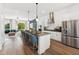 Spacious kitchen with an island, stainless appliances, open to the living area, and bar stool seating at 2808 Kempthorne Rd # 61, Cary, NC 27519