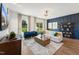 Bright living room with a modern chandelier, stylish furniture, and large windows offering scenic views at 2808 Kempthorne Rd # 61, Cary, NC 27519