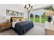 Serene main bedroom with large windows providing natural light and outdoor views, complemented by stylish decor at 2808 Kempthorne Rd # 61, Cary, NC 27519