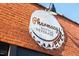 Pharmacy Bottle + Beverage sign on a brick building with a unique metal sign at 2808 Kempthorne Rd # 61, Cary, NC 27519