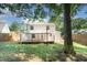 A view of the house with a large backyard and a covered patio at 2817 Henslowe Dr, Raleigh, NC 27603
