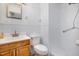 This bathroom features a white tiled shower and a wood vanity at 2817 Henslowe Dr, Raleigh, NC 27603