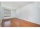 This bedroom features wood floors, a window and a ceiling fan at 2817 Henslowe Dr, Raleigh, NC 27603