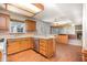 Functional kitchen with stainless steel appliances, lots of cabinet space, and a breakfast bar overlooking the living area at 2817 Henslowe Dr, Raleigh, NC 27603