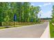 Street view of the Brookshire neighborhood entrance showcasing signage and landscaping at 302 Rosewood Dr, Sanford, NC 27330