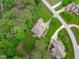An aerial view of a private home and yard backed by mature trees at 3104 Whitehart Ln, Apex, NC 27539