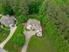 Aerial view of a meticulously landscaped home with lush lawn and mature trees at 3104 Whitehart Ln, Apex, NC 27539