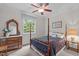 Bedroom with wood furniture, a ceiling fan, and a window view at 3104 Whitehart Ln, Apex, NC 27539