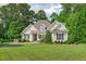Charming front exterior of this home with a well-manicured lawn and mature landscaping at 3104 Whitehart Ln, Apex, NC 27539