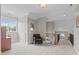 Hallway with neutral carpeting and walls, a wooden staircase, and lots of natural light at 3104 Whitehart Ln, Apex, NC 27539