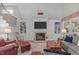 Spacious living room features built-in cabinets, a fireplace, and large windows at 3104 Whitehart Ln, Apex, NC 27539