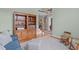 Cozy living room featuring wooden bookshelves, stairway, and natural light at 3104 Whitehart Ln, Apex, NC 27539