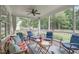 Inviting screened porch furnished with comfortable chairs and decor at 3104 Whitehart Ln, Apex, NC 27539