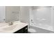 Bathroom featuring a shower and bathtub combination, and a sleek vanity at 32 Iroquois Ct, Garner, NC 27529